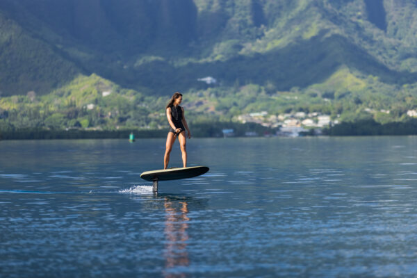 Fliteboard PRO elegantly gliding on the pristine surface of a crystal clear lake, showcasing the pinnacle of aquatic exhilaration.