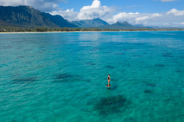 Fliteboard gracefully gliding across a stunning lake, showcasing the perfect blend of serenity and adventure.