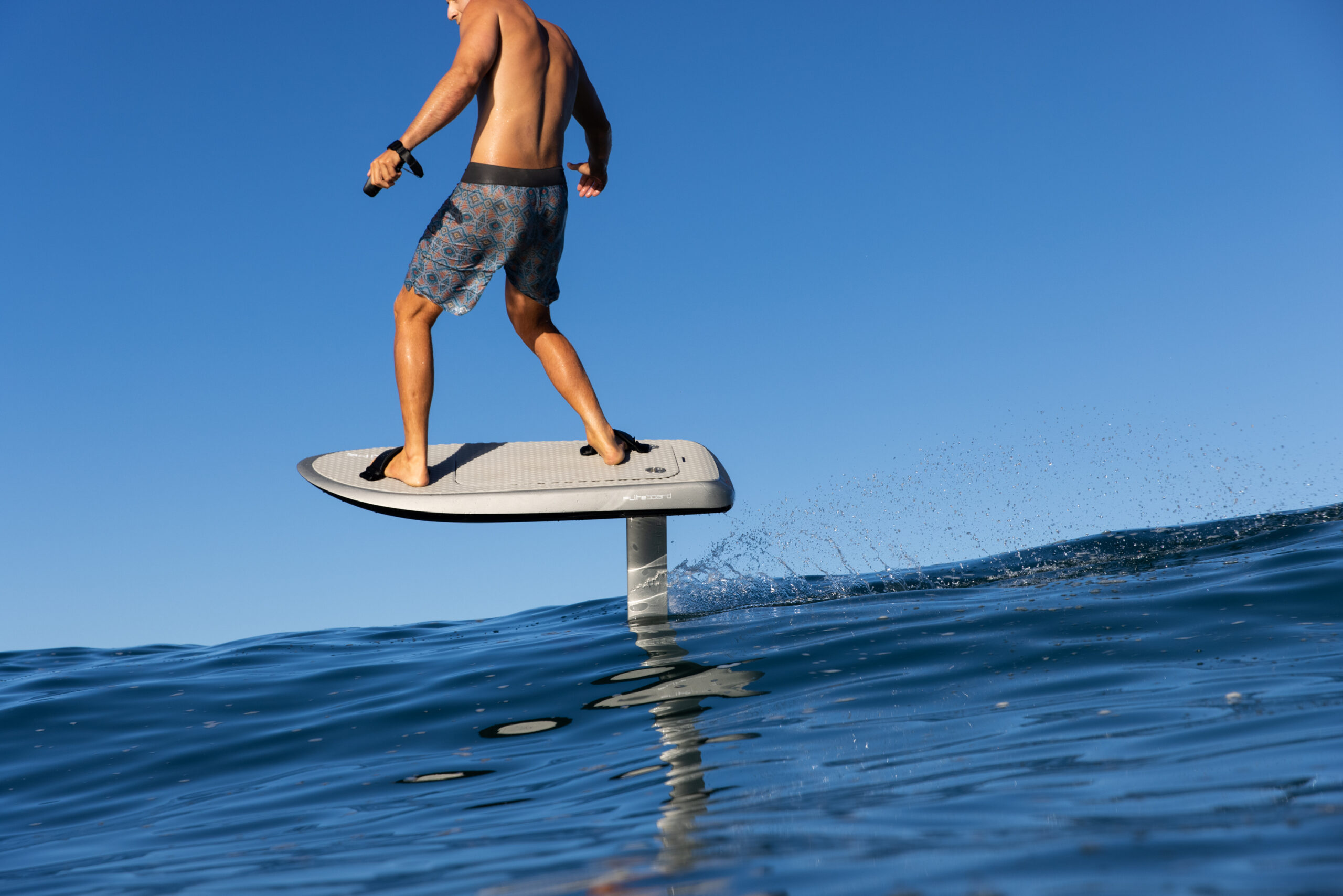 Fliteboard ULTRA gliding across scenic Utah lakes, blending exhilarating performance with stunning natural beauty for an unforgettable water adventure.