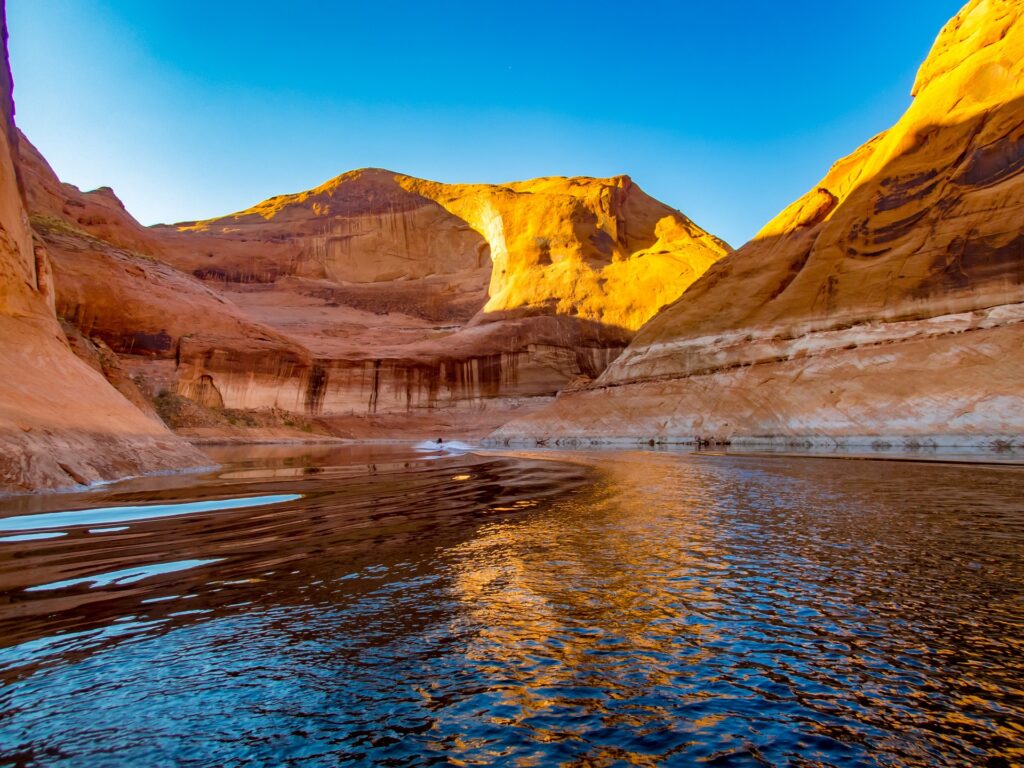 Boating and paddleboard rentals on Lake Powell in Utah and Arizona canyons